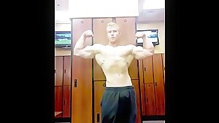 Hot blonde hunk flexing