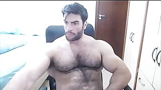 Hairy muscle hunk flexing