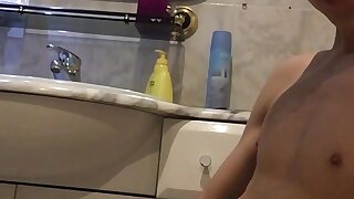Adorable teen jerks his thick dick in the bathroom
