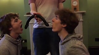 Two fags made to deep throat double sided dildo and kiss, while they get photographed
