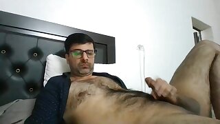 Hairy hot desi guy shoots big load on belly
