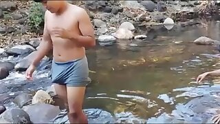 Salvadore villagers bathing in the river