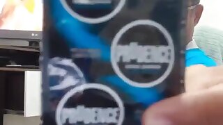 Big-dicked dude trying on a condom