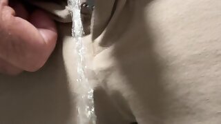 Guy pissing through fireskin