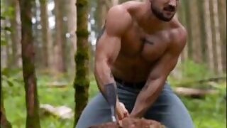 Lumberjack chopping wood and shooting cum