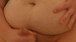 A big fat busty guy cums in his hand in the toilet