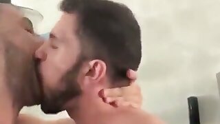 Two boys kiss passionately