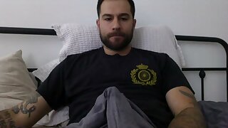 He jerks off his bulge through his shorts then takes it off and jerks off his huge cock